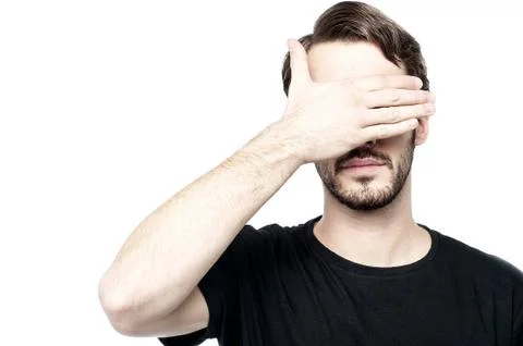 Man making see no evil gesture Stock Photos