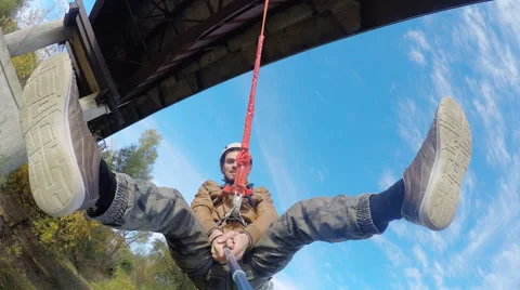 Man making self during the pendulum on a rope Stock Footage 59602636