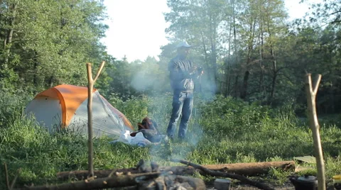 Man making selfie with camera in camping Stock Footage 64049868