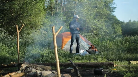 Man making selfie by smartphone in camping Stock Footage 64058019