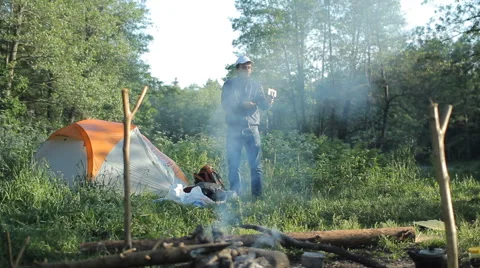 Man making selfie by smartphone in camping Stock Footage 64058106