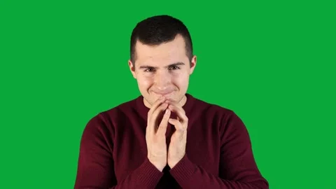 Man making sly face on green screen Stock Footage 145928443