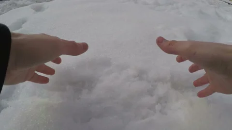Man making snowball Stock Footage 58797046