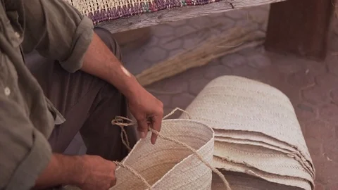 A man making some traditional objects at Djerba houmet souk Stock Footage