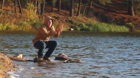 Man making splashes on the lake Stock Footage 42772351