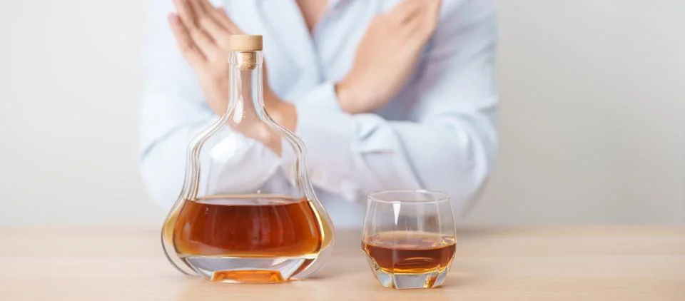 Man making stop hand gesture to refuse a glass of Cognac, Healthy man say n.. Stock-Fotos