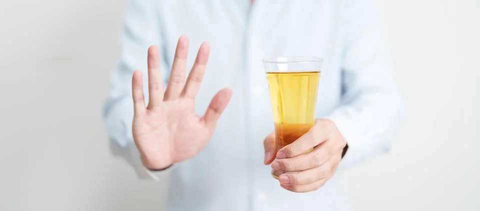Man making stop hand gesture to refuse a glass of Beer, Healthy man say no .. Stock-Fotos