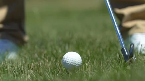 Man making swing to hit golf ball and missing, failed attempt, slow-motion Stock Footage