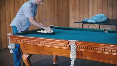 Man is making together balls for playing billiards Stock Footage 81544225