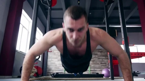 Man making trx lunge press exersices Stock Footage 73997900