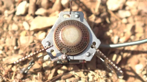 A man making Turkish coffee  on a camping stove outdoor Stock Footage 139496625