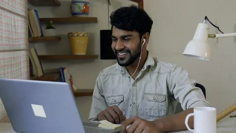 Man making a video call or video conference with his friends,family while sta Vídeos de archivo 155575639
