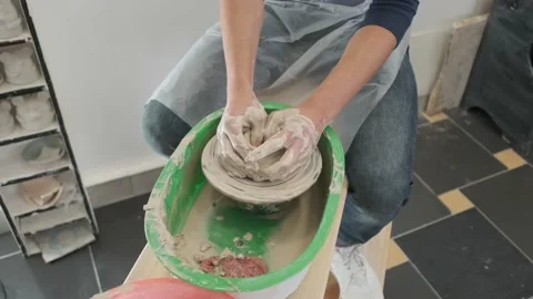 Man is making a ware in the pottery studio, without face Stock Footage 130875118