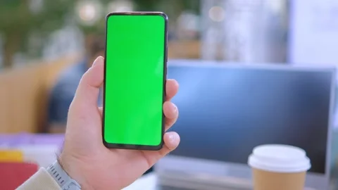 Man at mall Sits by the table using Smartphone with Green Mock-up Screen, Doing 스톡 동영상 254878434
