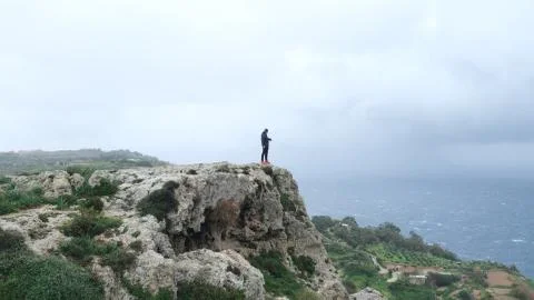 Man on Malta Cliff Stock Photos