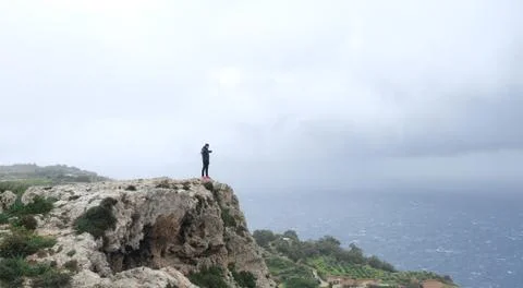 Man on Malta Cliff Stock Photos