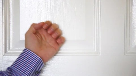 A man man hand knocking the door Stock Footage 129176207