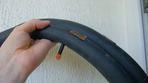 Man man patching rubber tube of bicycle patches visible hands man camera 스톡 동영상 310606928