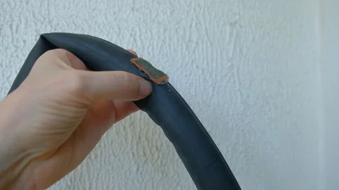 Man man patching rubber tube of bicycle patches visible hands man camera 스톡 동영상 327523256