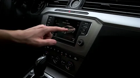 Man manages the menu in the car Stock Footage 73941440