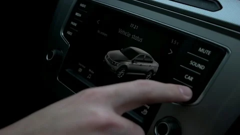Man manages the menu in the car Stock Footage 73941854