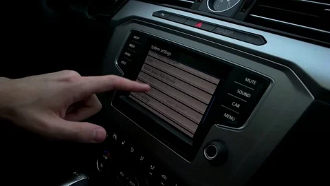 Man manages the menu in the car Stock Footage 73941880