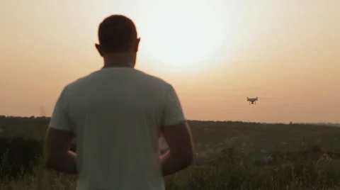 Man manages quadrocopters Stock Footage 64300925