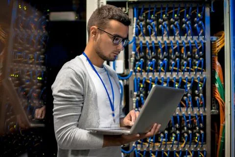 Man Managing Supercomputer Servers 스톡 사진