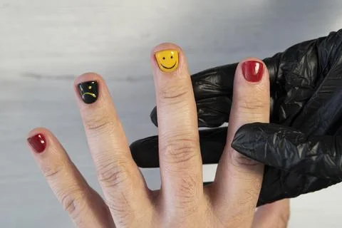 Man manicure. The process of coloring nails on men's fingers in a beauty sa.. Stock Photos