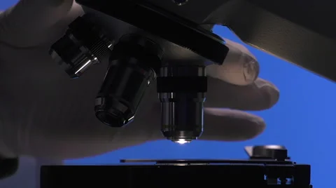 Man manipulating a microscope Video stock 64287512
