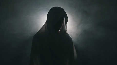 Man in mantle in the dark Stock-Footage 165594766