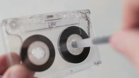Man manually rewind a cassette tape Stock Footage 101338225