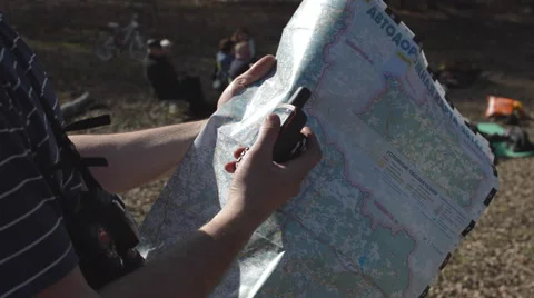 Man With Map and Navigator in Forest Stock Footage 62416024