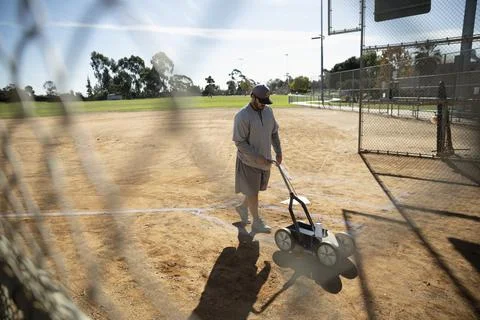 Man marking baseball field lines Stock Photos