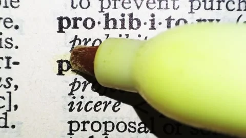 A man marks the word project definition on a printed page with a marker pen Stock Footage 297282730