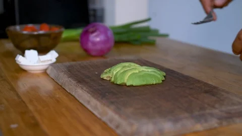 Man mashing avocado with a fork Stock Footage 100040583
