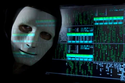A man in a mask on the background of binary code. 库存照片
