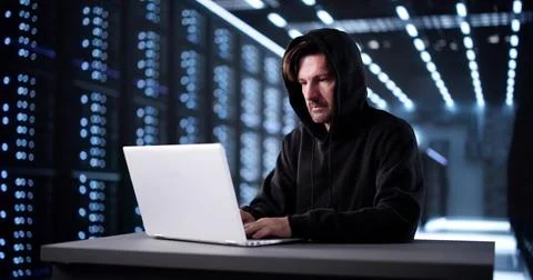 Man In Mask Breaks Into Virtual System, Hacking For Data. Stock Photos