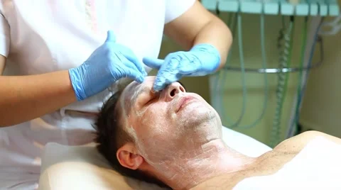 Man in the mask cosmetic procedure in spa salon Stock Footage 55450146