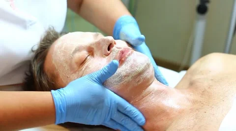 Man in the mask cosmetic procedure in spa salon Stock Footage 55450147