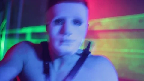 Man in mask dancing in night club Stock-Footage 80205030
