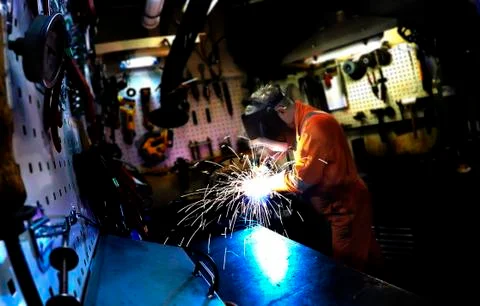 Man in a mask does welding machines Stock Photos