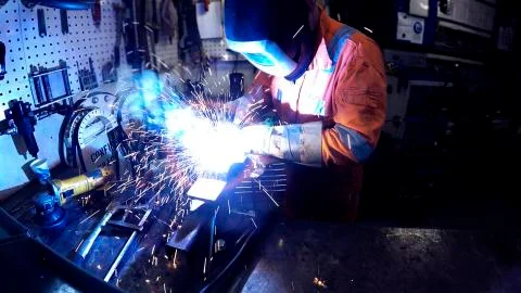 Man in a mask does welding machines Stock Photos
