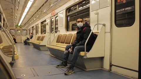 Man in the mask in the empty transport Stock Footage 127717219