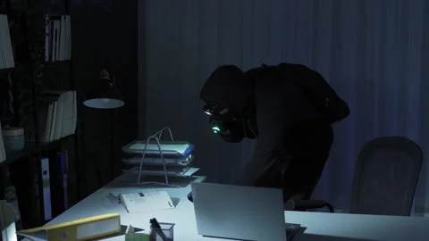 Man with mask on face commits robbery in office. Video stock 221657345