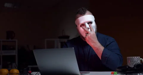 A man in mask makes a threatening gesture I'm watching you Stock Footage 145742126