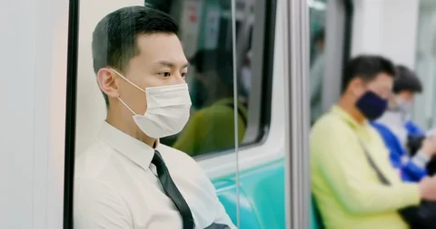 Man with mask in metro Stock Footage 128299972