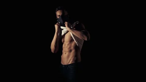 Man in mask is posing in a flashing light Video stock 85881846