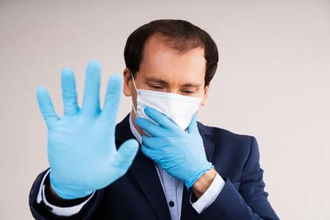 Man In Mask Suffering From Panic Attack Foto stock