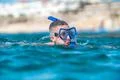 The man with mask swim in the ocean Photo